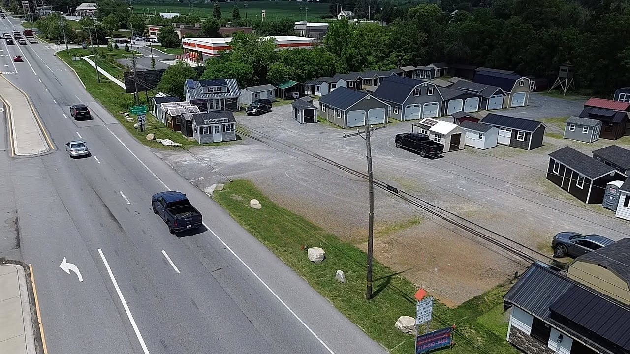 Aerial view of the White Pine Structures sales lot on Route 30 in Parkesburg, PA, with dozens of sheds and garages on display