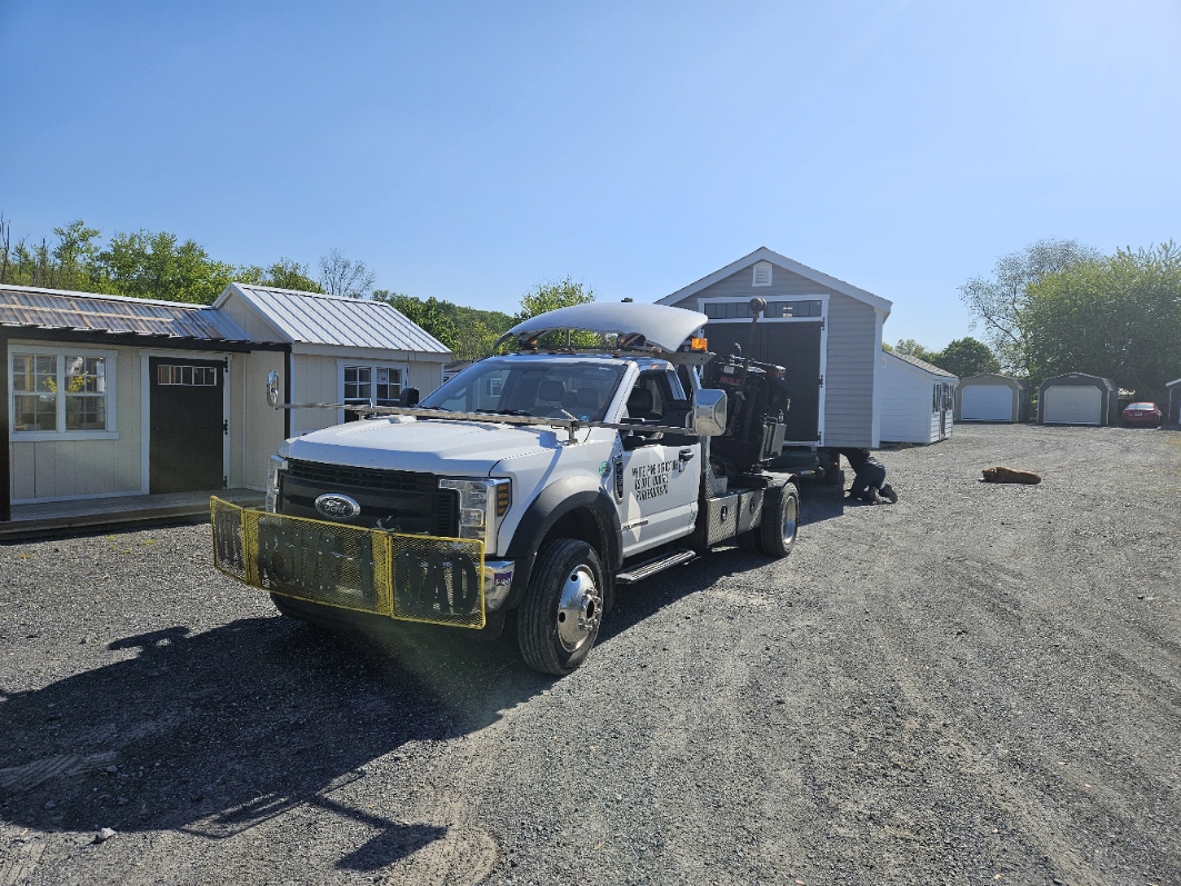 White Pine Structures delivery truck with the Shed Mule loaded on back, at the Parkesburg sales lot